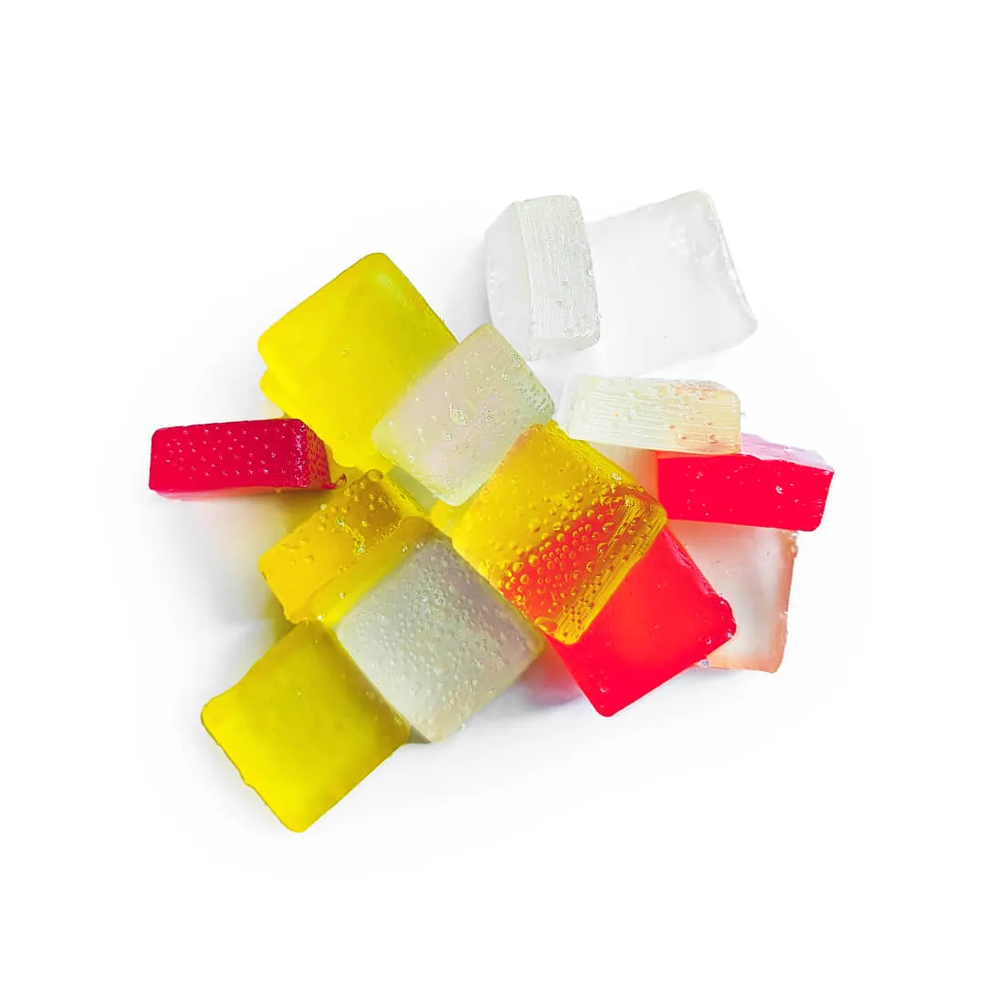 A pile of colorful Ice Cream Shoppe gummies on a white background.