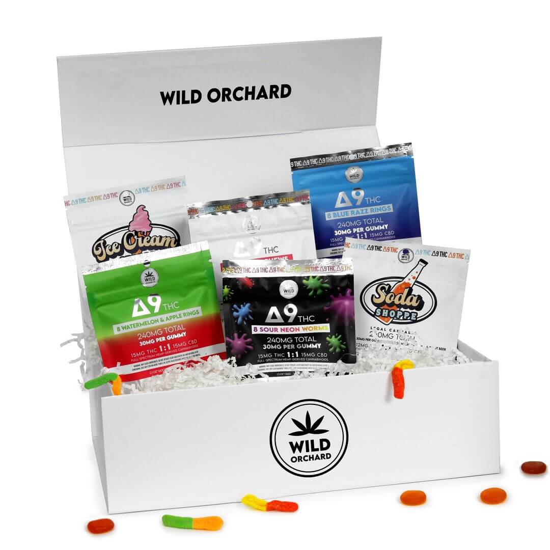 An open wild orchard bundle filled with various thc-infused edible products including Delta 9 Gummies Bundle and soda bottles.