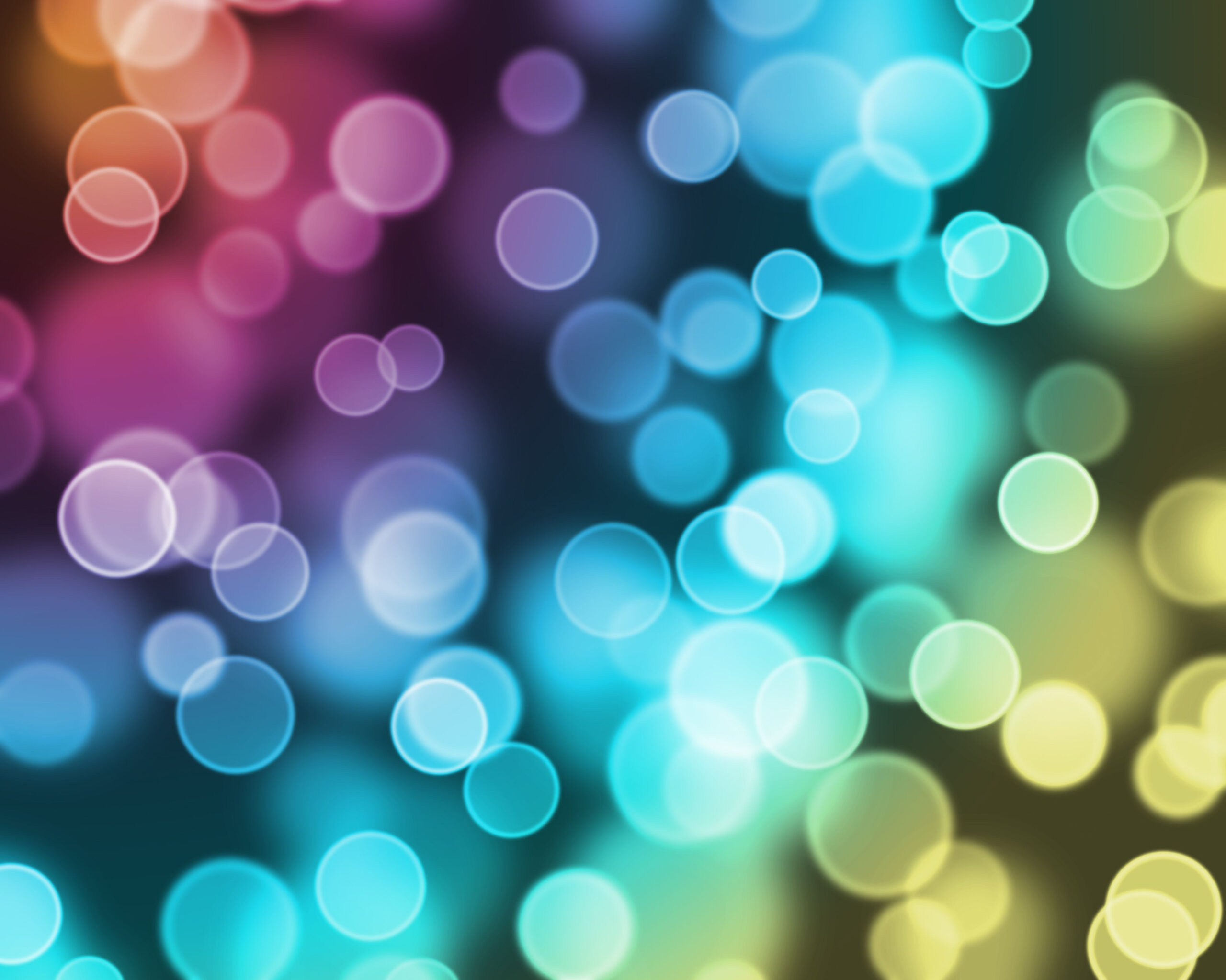Colorful bokeh lights background with a soft blur effect.
